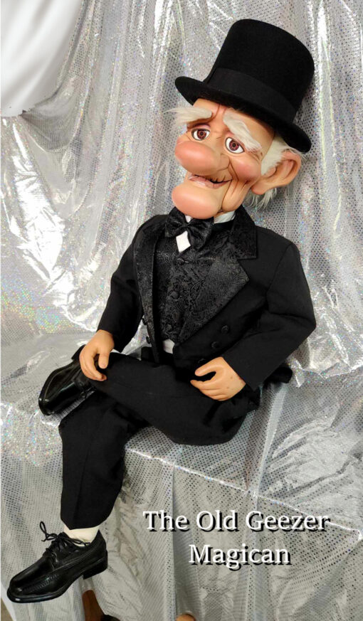 Old-fashioned ventriloquist dummy in tuxedo.