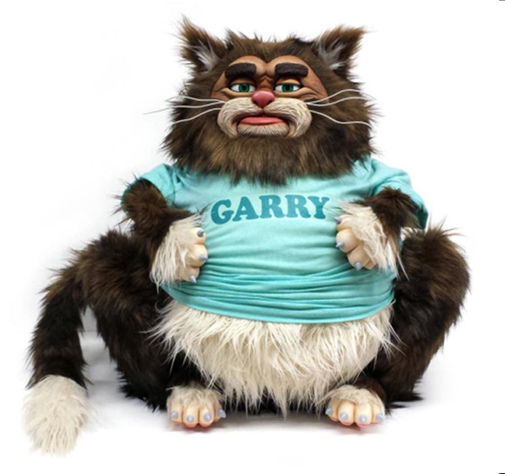 A stuffed cat with a t-shirt on.